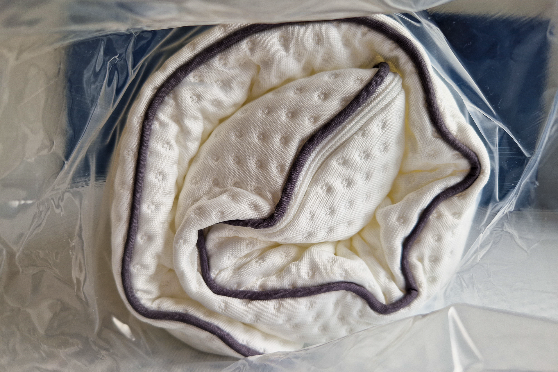 Emma pillow in plastic